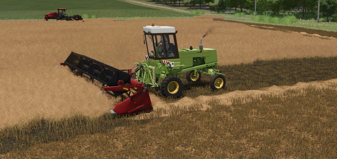 Farming Simulator 25 mod: green Fortschritt E 303 harvester working in a wheat field, capturing realistic farming gameplay.