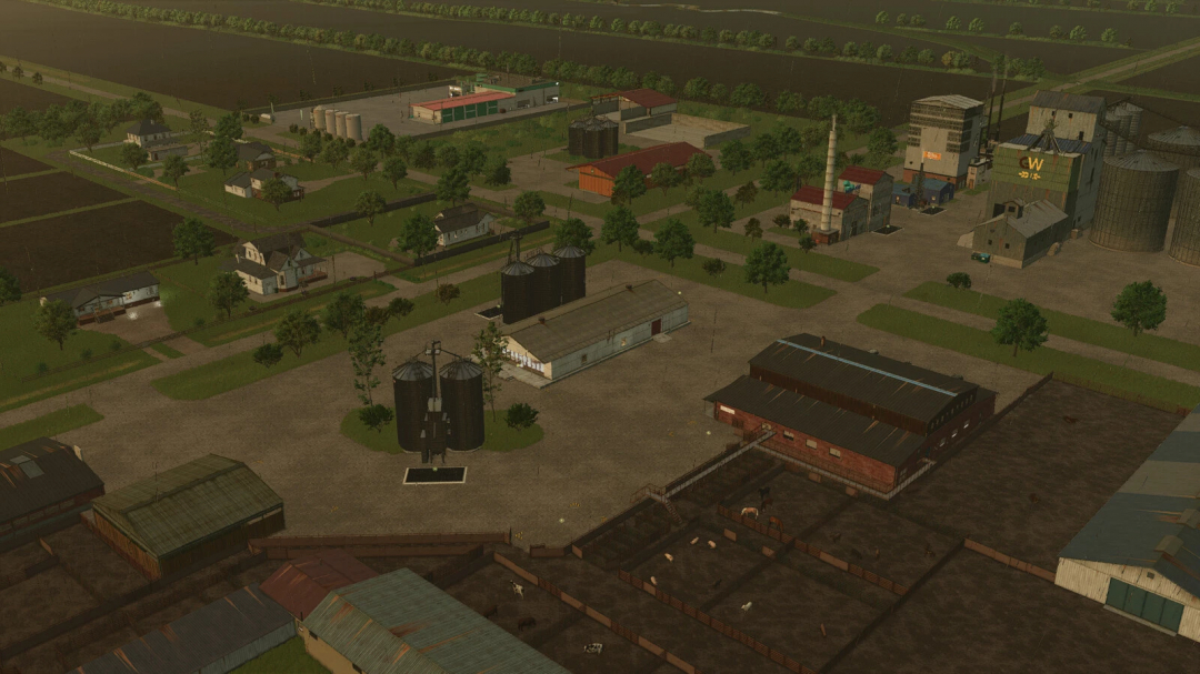 Aerial view of Gnadenthal Map v1.2.0.0 from Farming Simulator 25, showing farms, silos, fields, and small houses in a rural area.