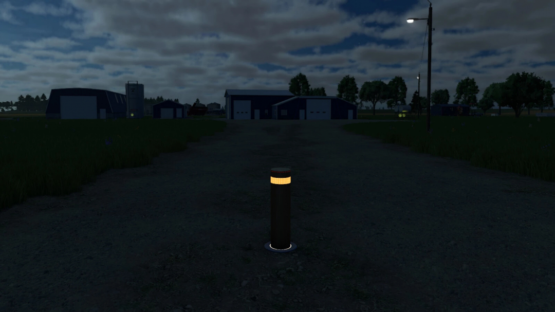 Night image of a farming area in Farming Simulator 25 with a glowing bollard in the center, showcasing a mod for realistic lighting.