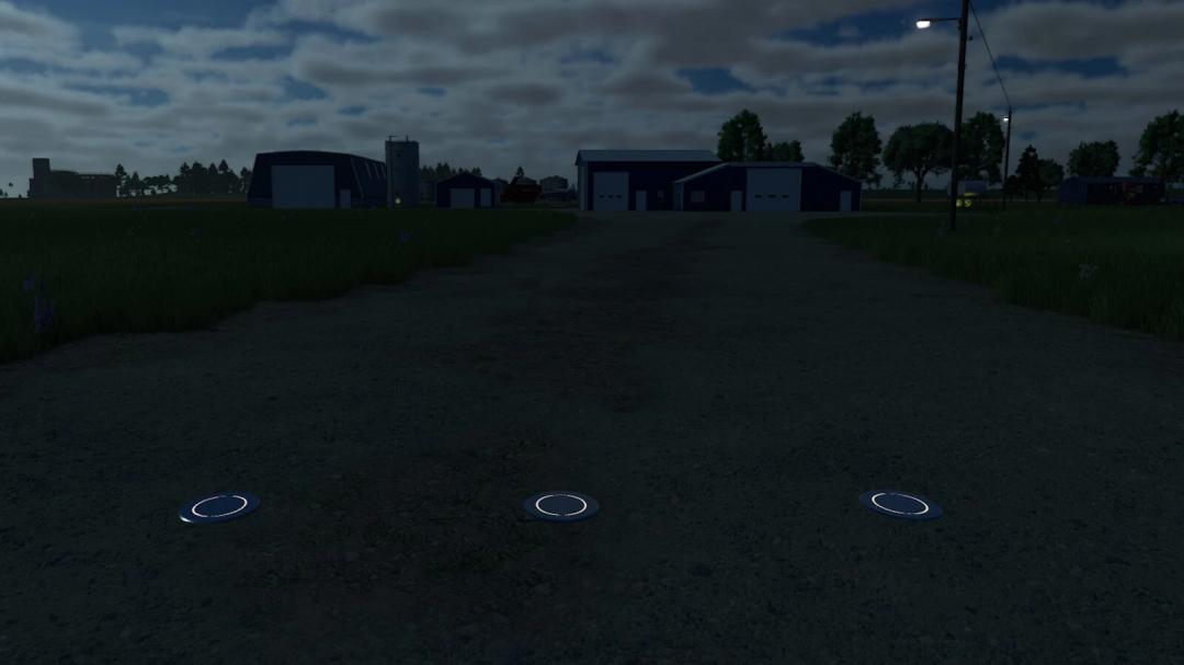 Farming Simulator 25 mod: Hydraulic Bollard v1.0.0.0 with illuminated circles on the ground, used for managing access points.