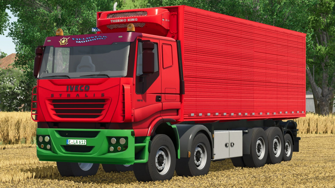Iveco Stralis truck with trailers mod in Farming Simulator 25, featuring a red cab, green accents, and a large enclosed trailer, on farmland.