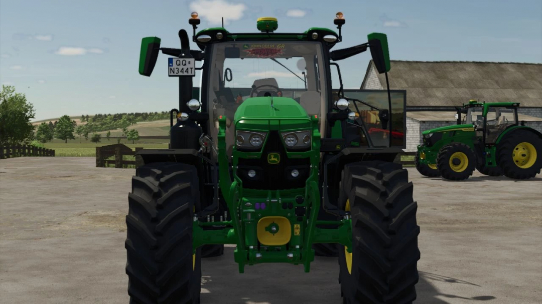 John Deere 6R 145-185 v1.4.2.0 mod in Farming Simulator 25, front view of a green tractor with large tires, farm background.