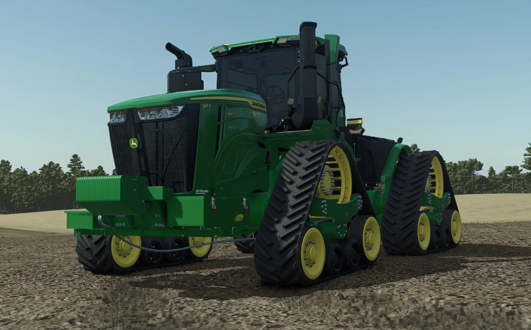John Deere 9RX Signature US Spec mod in Farming Simulator 25, featuring tracked agricultural machinery with green and yellow design on farmland.