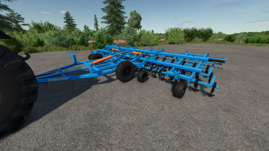 Farming Simulator 25 mod: Blue KBM-8PS cultivator attachment on a gravel surface with green trees and bushes in the background.