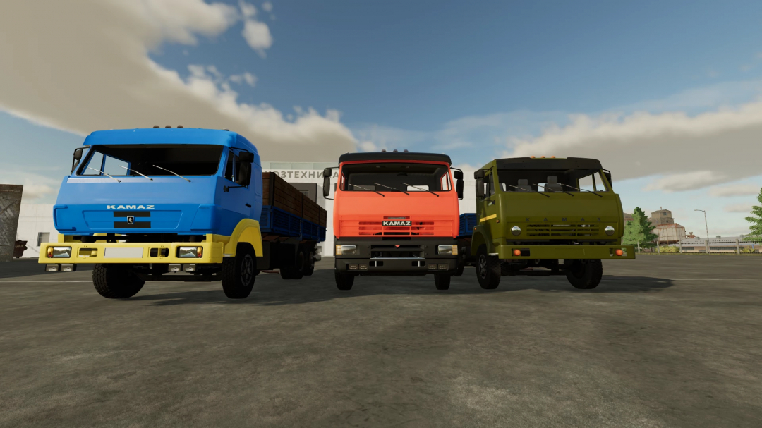 Three KAMAZ trucks from FS22 mods parked outdoors, showcasing different colors and models in Farming Simulator 22.