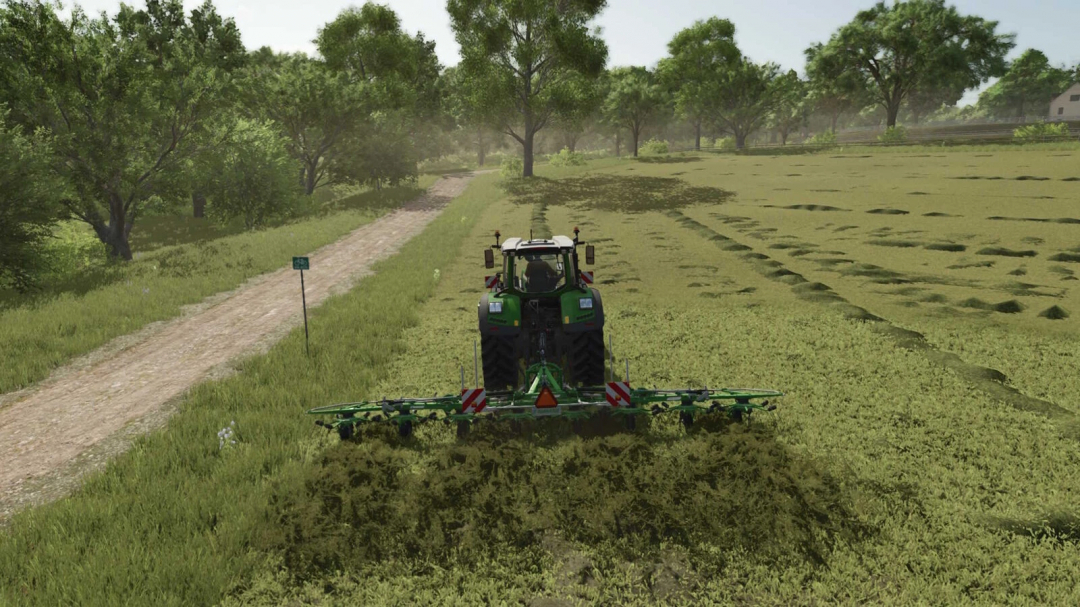 Farming Simulator 25 mod: tractor with MultiFruit AI Tedder v1.0.0.0 working on a field, with trees and a dirt path in the background.
