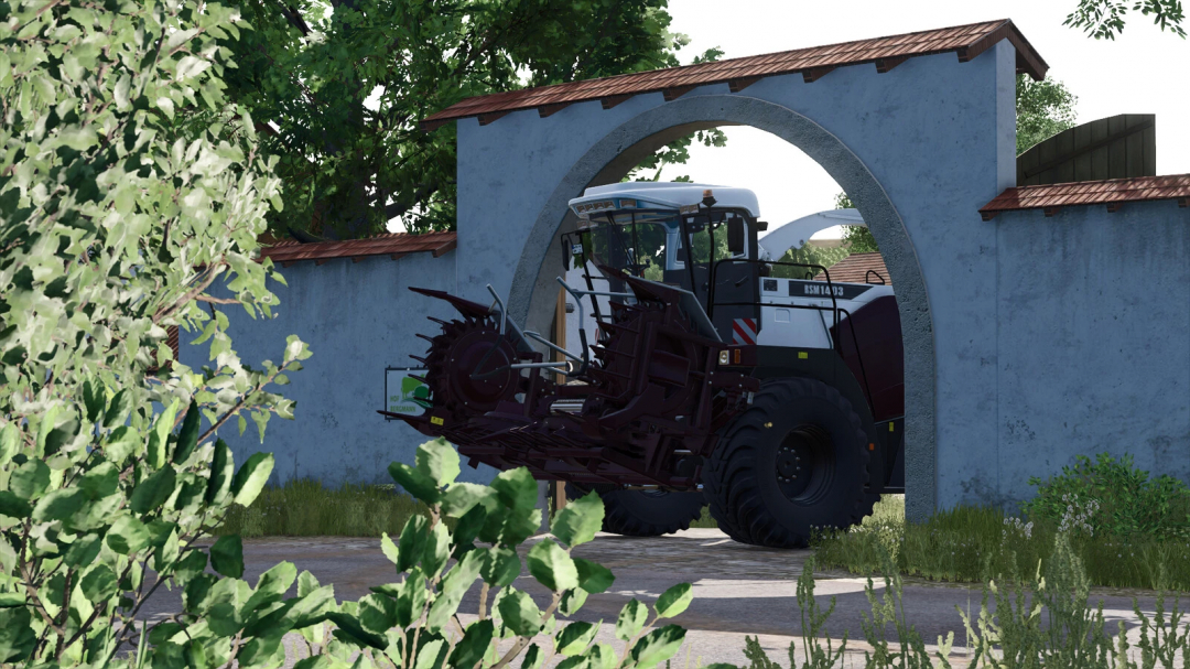 Farming Simulator 25 mod: Rostselmash 1403 Pack v1.0.0.0, tractor with crop harvesting equipment approaching an arch-shaped blue farm building.