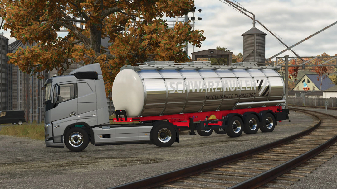 Farming Simulator 25 mod screenshot of a Schwarzmüller Food Tank v1.0.0.0 on train tracks, with autumn trees in the background.