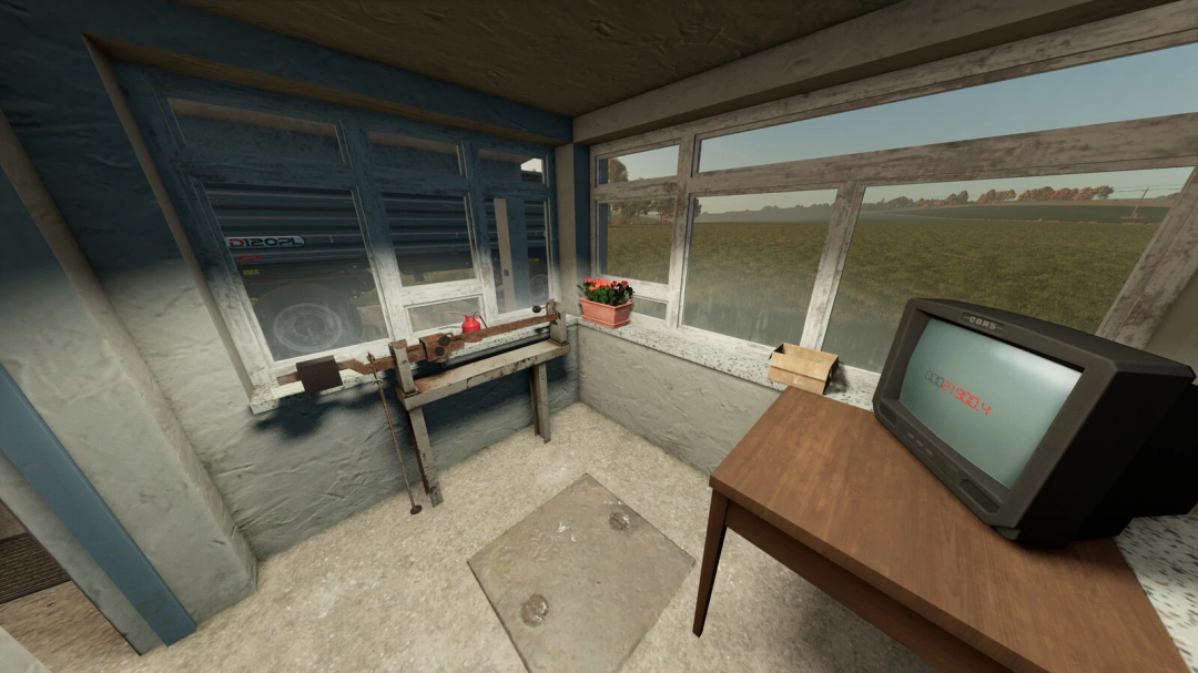 Inside a farm building in Farming Simulator 25, showing a weighing station with an old scale, a computer monitor, and a flower pot with a scenic view outside.