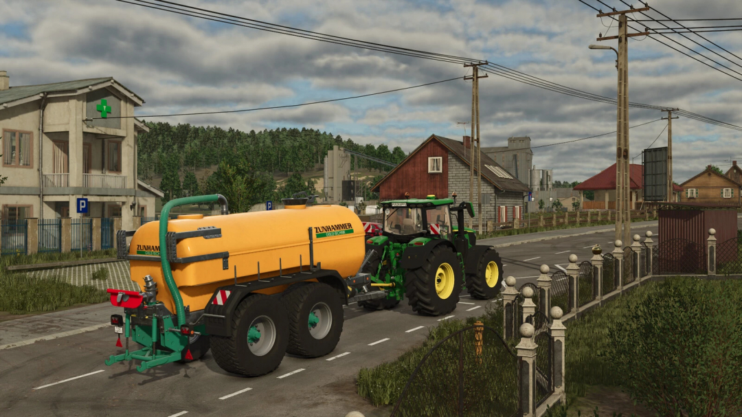 Farming Simulator 25 mod: Zunhammer SKE 18.5 PUD tank attached to a tractor on a rural road.