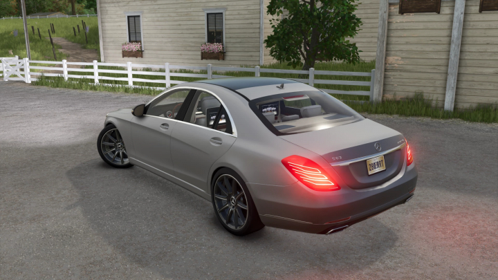 fs25-mods, Mercedes S Class mod from Farming Simulator 25, parked on a gravel driveway near a house with a white fence.