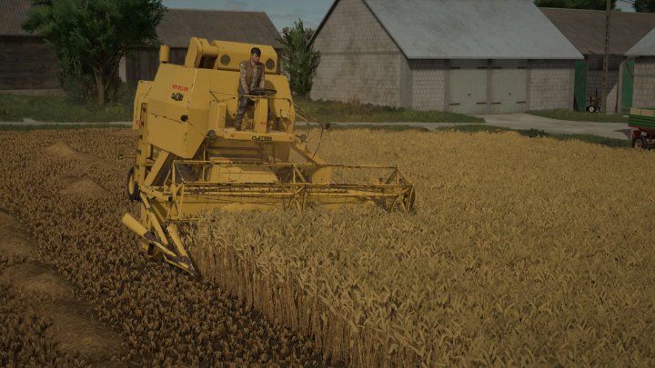 fs25-mods, Farming Simulator 25 mod: Yellow New Holland M135 harvester working in wheat field.