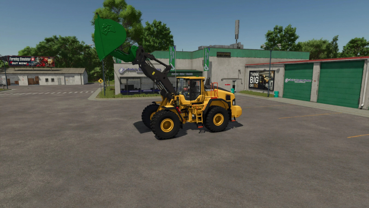 fs25-mods, Farming Simulator 25 mod: Yellow wheel loader with green shovel attachment in front of tire shop, showcasing the Wheel Loader Shovel Pack v1.0.0.0.