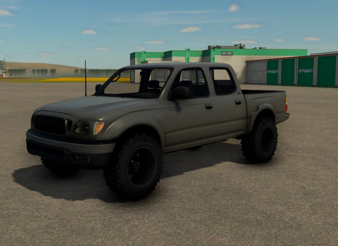 FS25 mods: A matte gray 2002 Toyota Tacoma pickup truck with off-road tires in Farming Simulator 25.