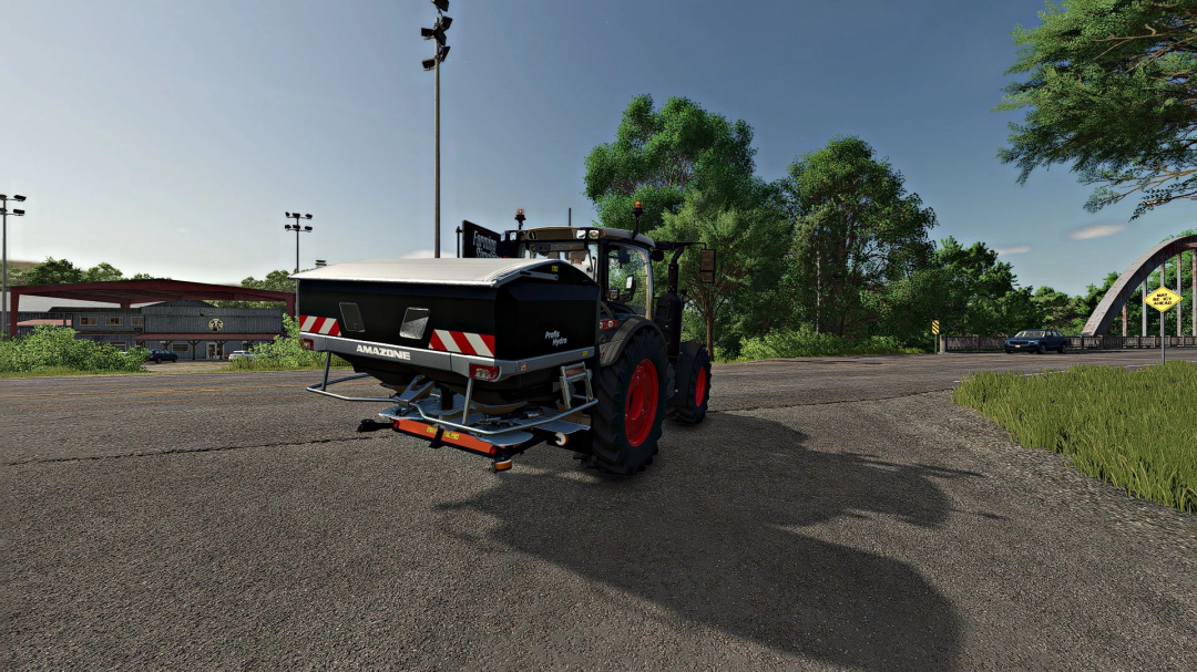 Farming Simulator 25 mod: Amazone ZA-TS 3200 fertilizer spreader attached to a tractor on a rural road.