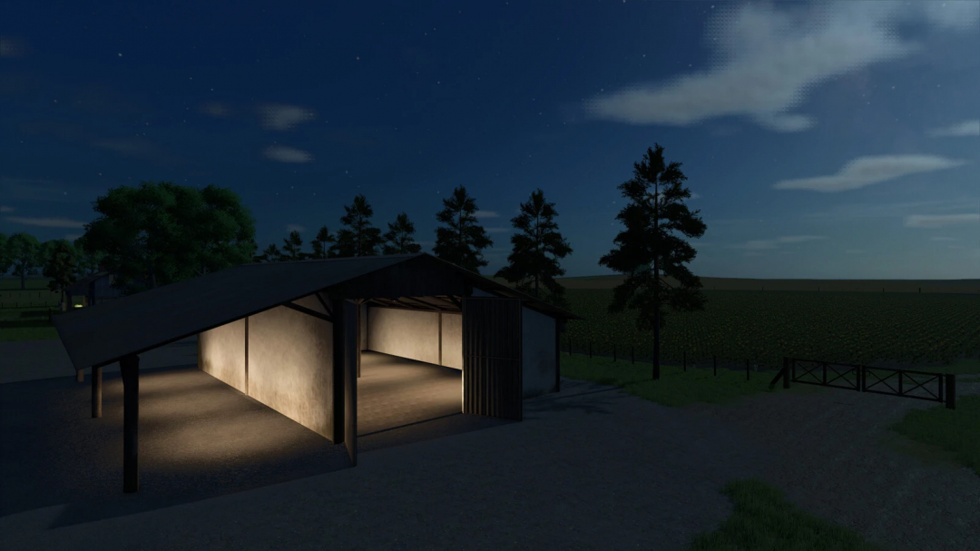Night view of the FS25 mod BR Small Shed v1.0.0.0 in Farming Simulator 25, illuminated from inside, with trees and open landscape nearby.