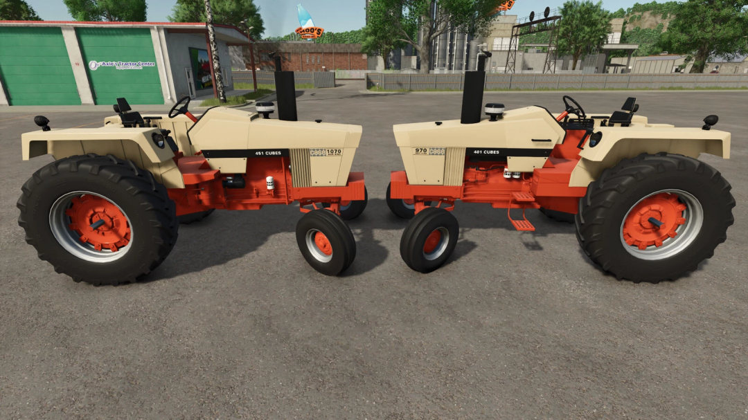 Two vintage Case tractors from Farming Simulator 25 mods, featuring beige and orange colors, parked on a farm yard.