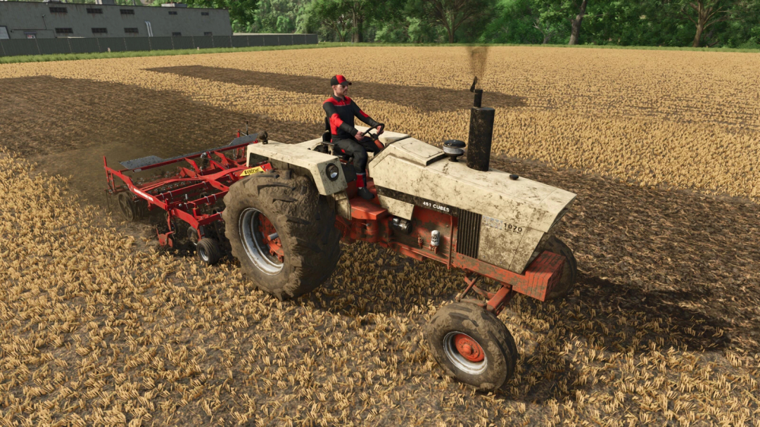 Farmer driving a Case 970 tractor with 1070 Agri King mod in Farming Simulator 25, working on a wheat field. Keywords: FS25 mods, Farming Simulator 25 mods.