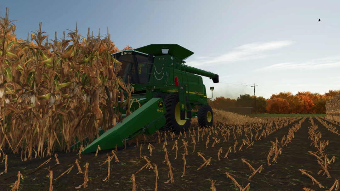 Farming Simulator 25 mod: John Deere 43 Series Corn Heads harvesting maize in a field during autumn.