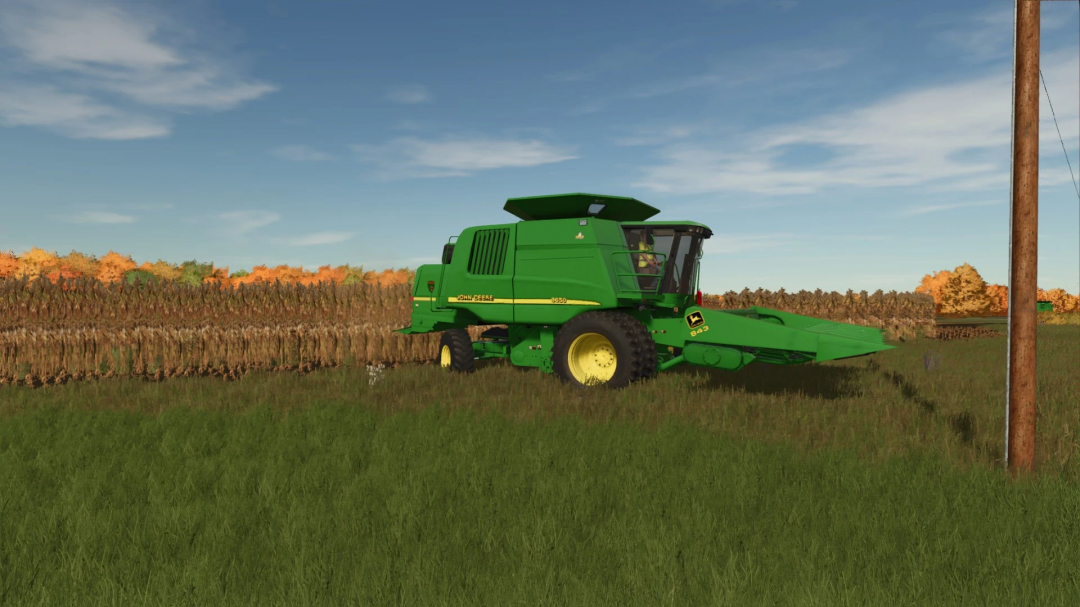 Farming Simulator 25 mod: John Deere 43 Series Corn Heads in FS25 with realistic crops and green field.