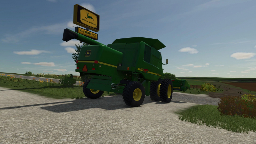 Farming Simulator 25 mods, showing a green John Deere Walker combine near a billboard with John Deere logo and MacFARLANE advertisement.