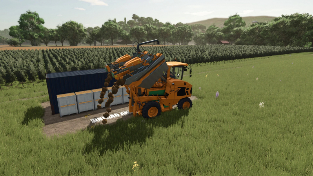 Farming Simulator 25 mod: a tractor unloading grape and olive storage containers in a lush field with trees in the background.
