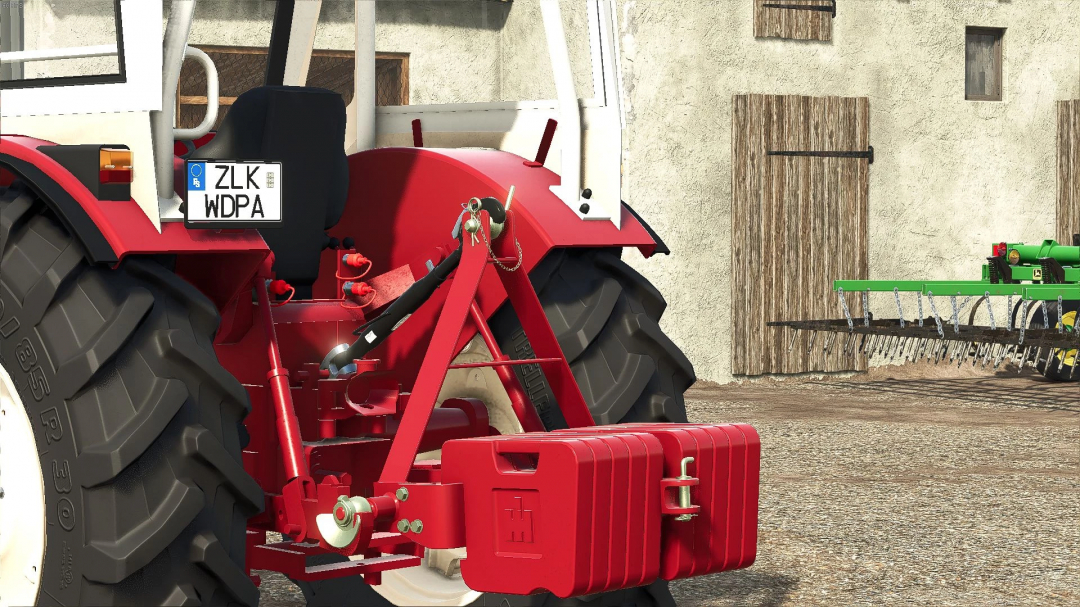 Farming Simulator 25 mod showing a red IHC weight attached to a tractor for FS25 gameplay.