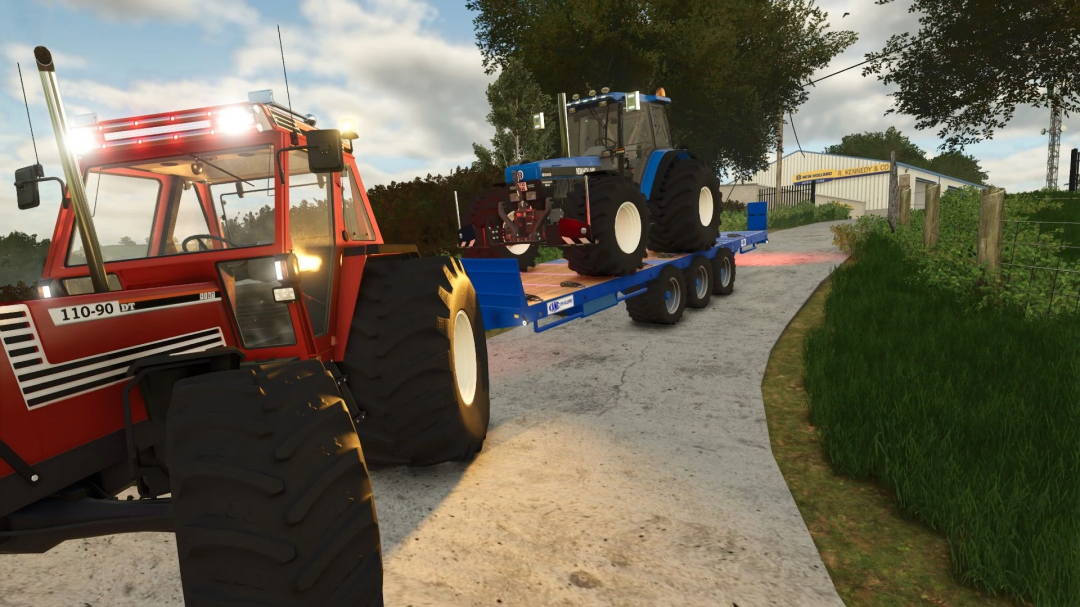 Farming Simulator 25 mod featuring a red tractor towing a blue trailer with a New Holland tractor, landscape with trees and building in the background.