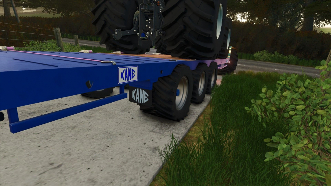 Close-up of the Kane LBT 24T v1.0.0.0 mod from Farming Simulator 25, featuring large tires and blue trailer.