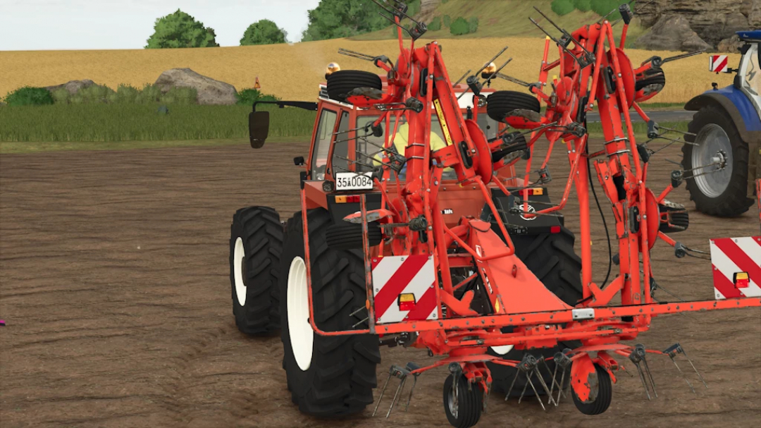 Farming Simulator 25 mod: Kuhn GF 8712 Rust Edition 1.1.0.0, a red agricultural hay rake attachment on a farm field.
