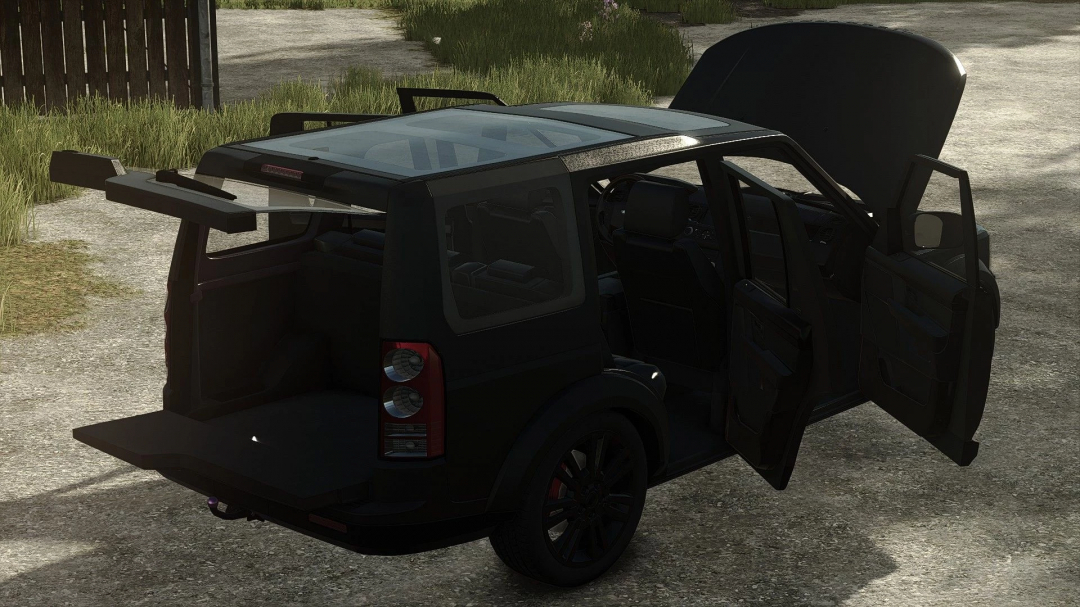 Land Rover Discovery 4 v1.0.0.0 mod in Farming Simulator 25, black SUV with open doors, rear hatch, and detailed interior, shown in a rural setting.