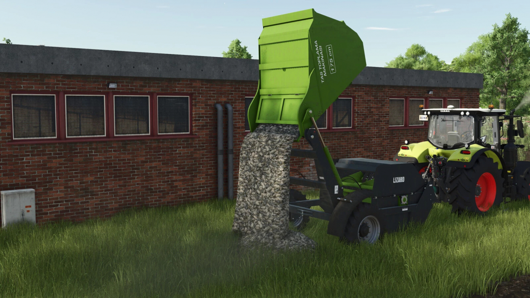 Farming Simulator 25 mod: Lizard Ozn Stone Collector v1.0.0.0 attaching gray stones to the green stone collector machine near a brick building.