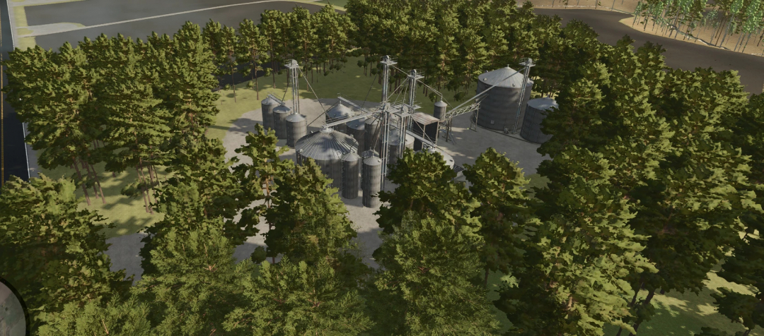 A detailed view of Mason County, West Virginia Map v1.0.0.0 from Farming Simulator 25 mods, showing grain silos and farm infrastructure among trees.