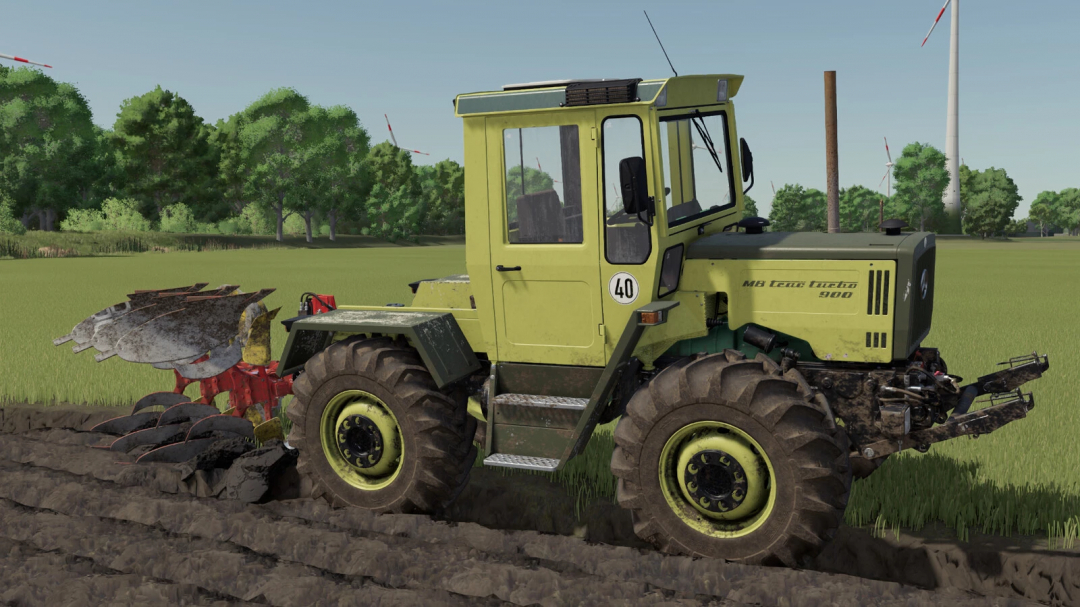 Farming Simulator 25 mod: MB Trac Series tractor plowing fields with green landscape and wind turbines in the background.