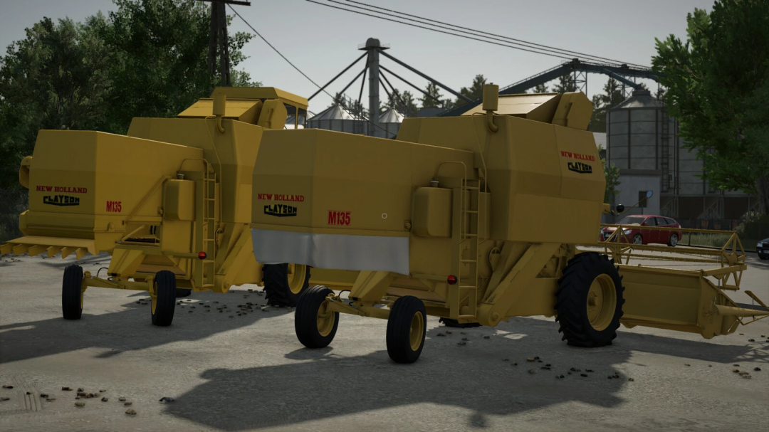 Farming Simulator 25 mods: New Holland M135 forage harvester in a farm yard scene, part of FS25 mods collection.