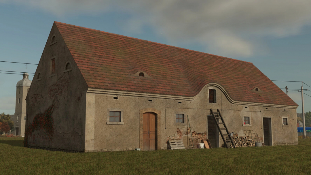 Old German barn from FS25 mods with weathered walls and a curved roof, suitable for Farming Simulator 25.
