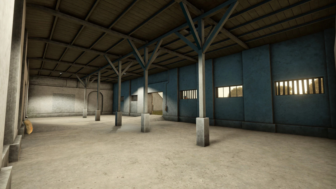 Farming Simulator 25 mod: Old Grain Storages Pack v1.0.0.0 inside a warehouse with concrete floors and blue walls, sunlight coming through windows.