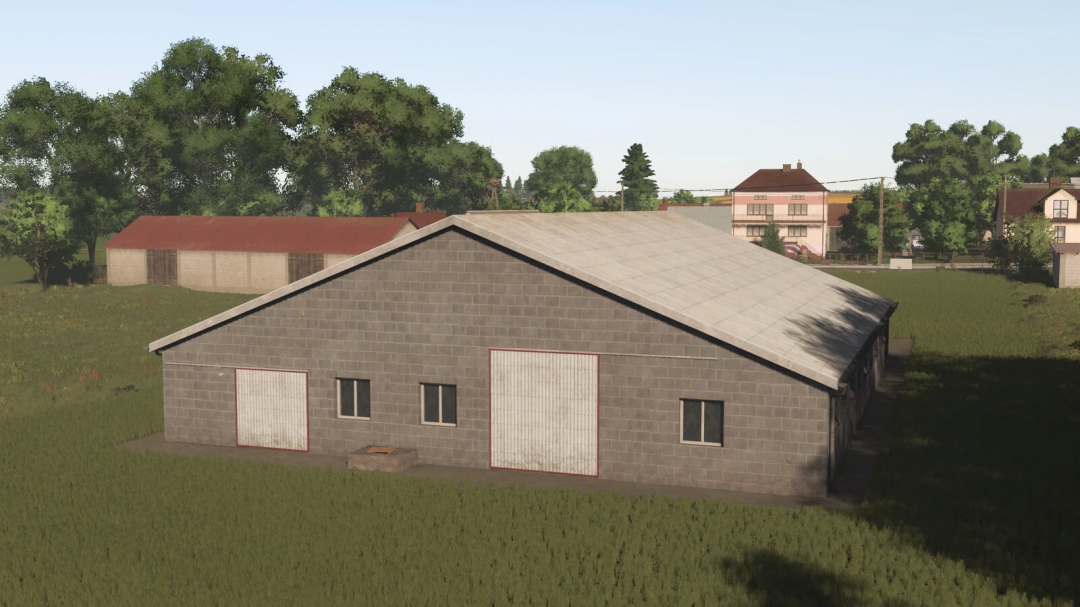 A gray concrete barn with red and white garage doors in a rural area, part of the Farming Simulator 25 mods, Polish Cowshed v1.0.0.0.