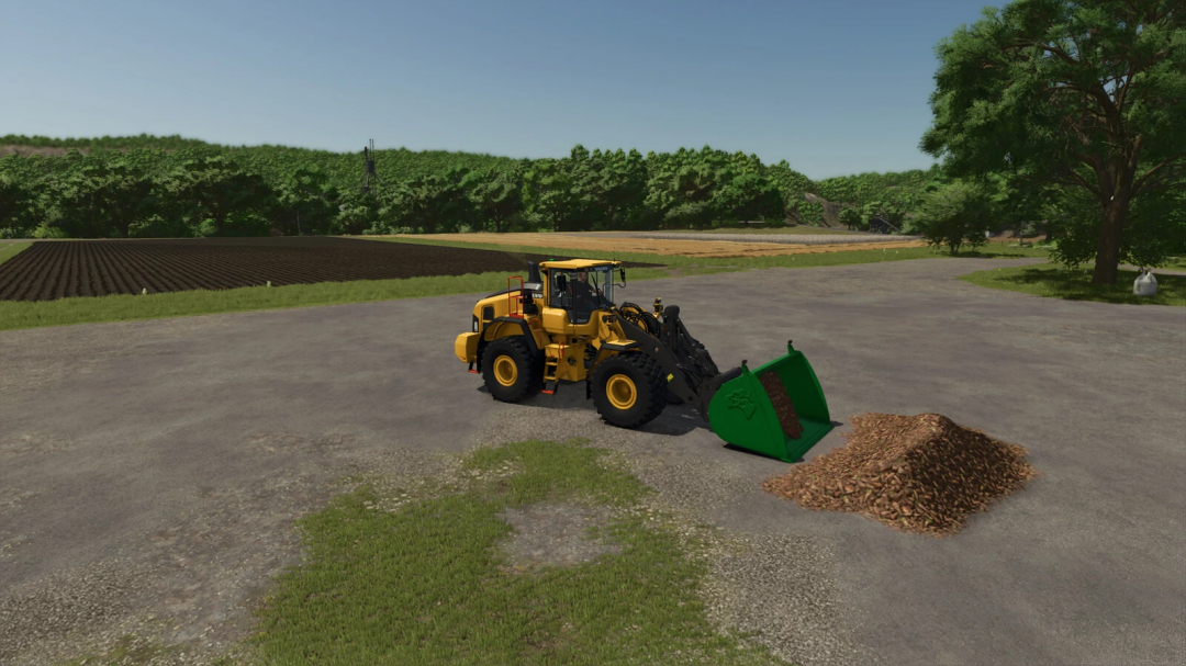 Farming Simulator 25 mod: Wheel Loader with shovel attachment removing a pile of mulch on a farm.