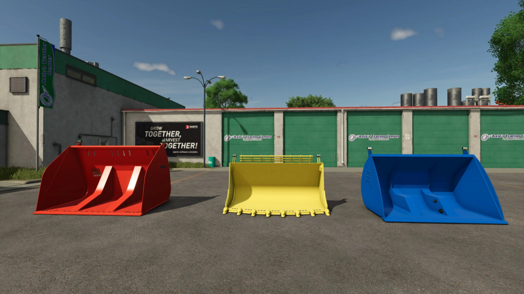 Three colorful wheel loader buckets in red, yellow, and blue for FS25 mods at Axle's Tractor Center.